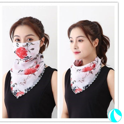 White women's UV protection scarf with black speckle pattern, worn as a face mask and neck scarf. - Image 2