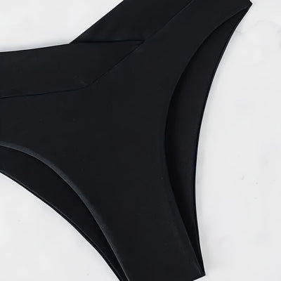 Women's black deep V push-up bikini with lace-up back and high-waisted bottom, laid flat on white marble. - Image 4