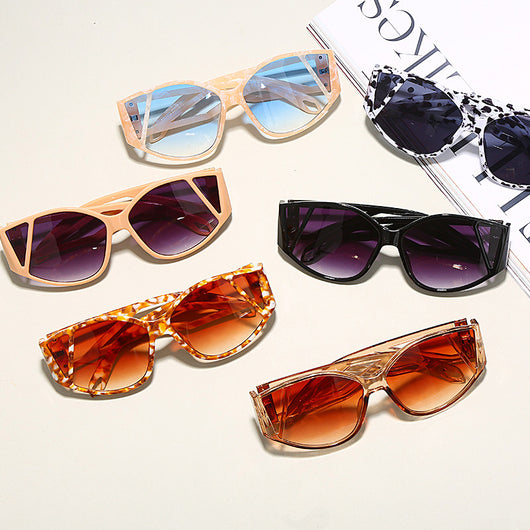 Light peach cat-eye sunglasses with purple gradient lenses and geometric cutouts on the frame. - Image 4