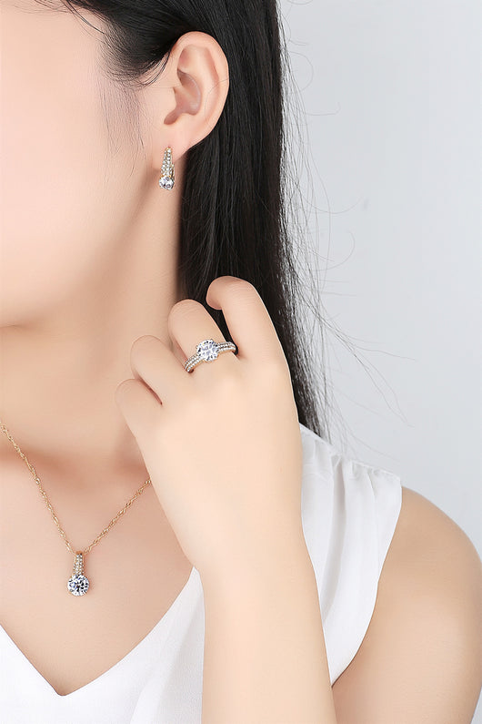 Gold-toned bridal necklace and hoop earrings set with large round cubic zirconia stones and pave accents. - Image 3
