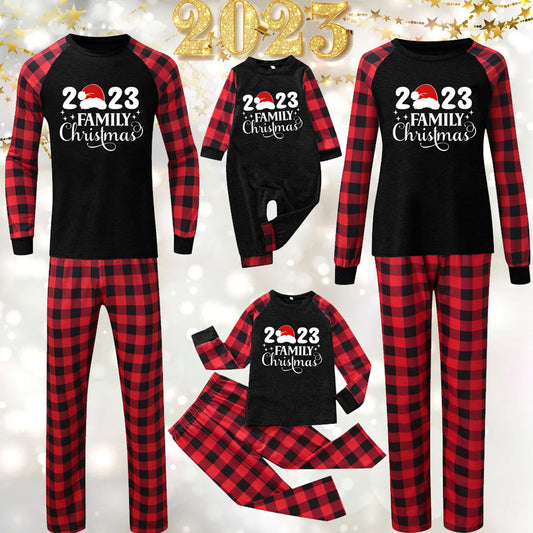 Red and black buffalo plaid Christmas pajama set with a long-sleeve top and matching pants. Top reads "2023 FAMILY Christmas".
