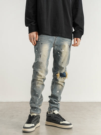 Jeans Slim Fit con Detalles de Tinta Salpicada y Parches Rotos
