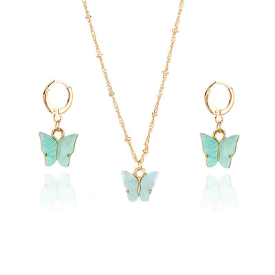 Pink acrylic butterfly necklace and earring set with gold-colored chain and hoop earrings. - Image 3