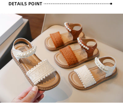 Children's white sandals with pearl ankle straps, woven front strap, and brown sole, featuring a Velcro closure. - Image 11