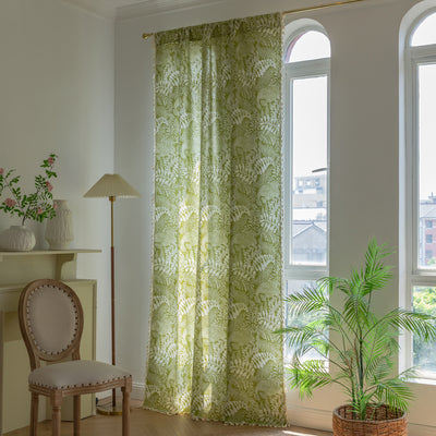 Green curtain with white leafy botanical pattern and cream tassels, hanging in a window with natural light. - Image 16