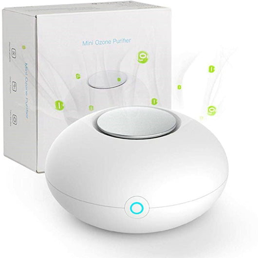 White mini ozone generator and air purifier with a round, compact design and a green indicator light.