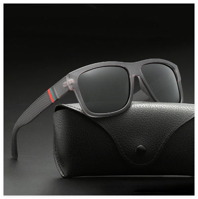 Men's grey plastic frame driving sunglasses with dark polarized lenses and red and black stripe detail on temples. - Image 10
