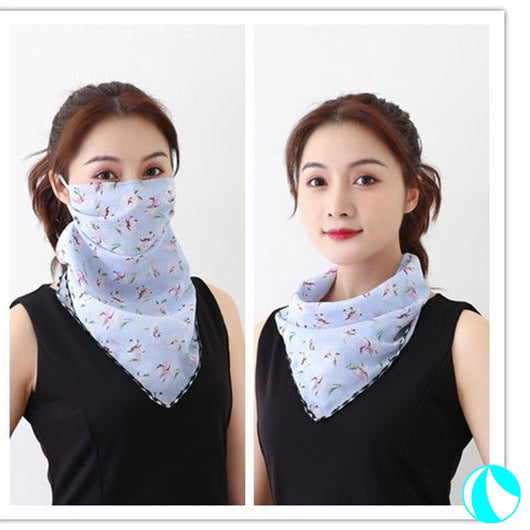 White women's UV protection scarf with black speckle pattern, worn as a face mask and neck scarf. - Image 14