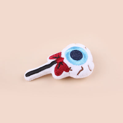 Plush cat teaser shaped like an eyeball lollipop with a blue iris, black pupil, and red bow. - Image 3