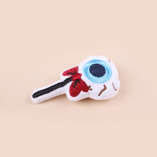 Plush cat teaser shaped like an eyeball lollipop with a blue iris, black pupil, and red bow. - Image 3