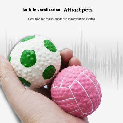 Pink latex pet toy shaped like a mini volleyball with white seams and a textured surface. - Image 2