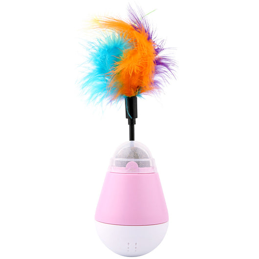 Pink and white tumbler cat toy with a clear dome revealing a catnip ball and a colorful feather wand.