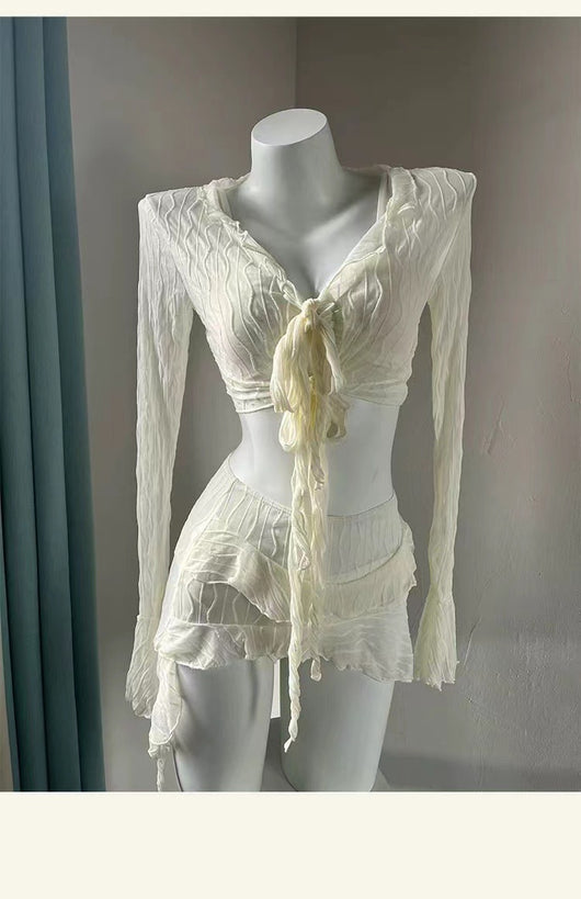White four-piece bikini swimsuit set for women, featuring a long-sleeve tie-front top and tiered ruffle skirt. - Image 17