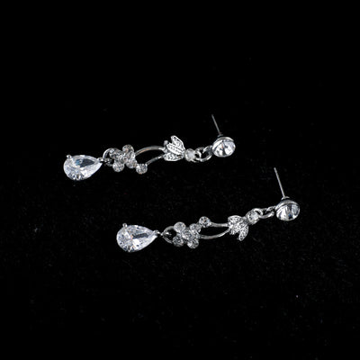 Silver-toned necklace and dangle earrings set with clear teardrop and round cubic zirconia stones in a floral design. - Image 4