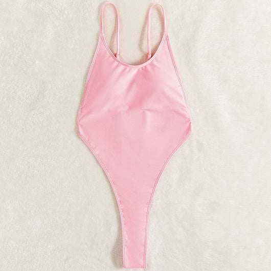 Light pink one-piece swimsuit with thin spaghetti straps and a high-cut leg design, worn by a woman. - Image 10