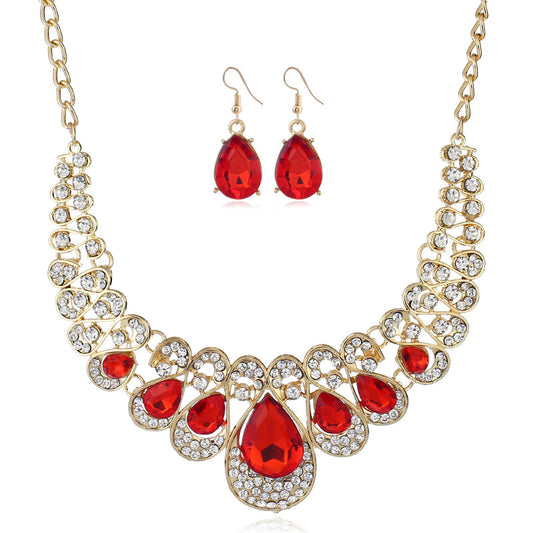 Gold-tone necklace and matching drop earrings set with clear teardrop gems and sparkling rhinestones. - Image 2