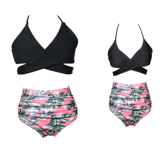Black wrap bikini top with high-waisted pink and green tropical leaf print swim bottoms. - Image 6
