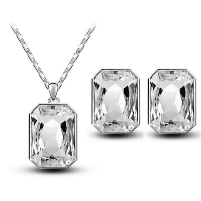 Teal rectangular crystal necklace and matching stud earrings set with silver-toned settings and chain. - Image 17