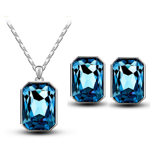 Teal rectangular crystal necklace and matching stud earrings set with silver-toned settings and chain. - Image 20