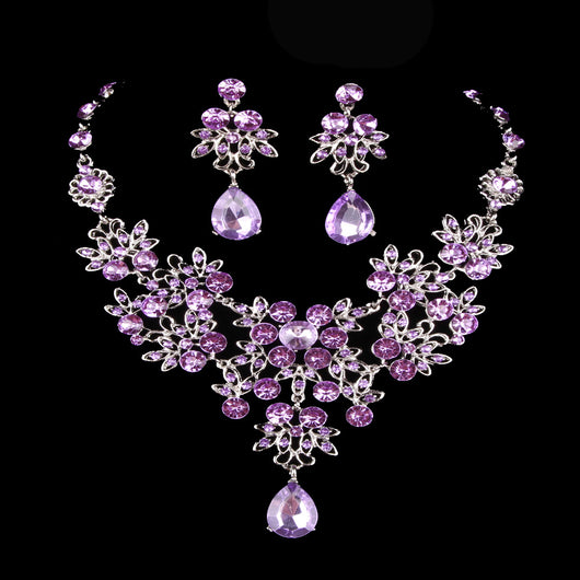 Purple crystal necklace and earring set with butterfly and floral designs, featuring large teardrop pendants. - Image 3