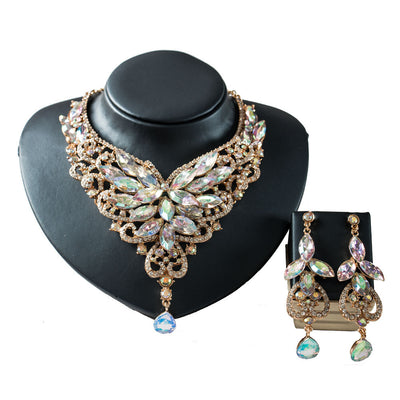 Exaggerated green gemstone necklace and matching dangle earrings set with gold-tone metal and clear accents. - Image 13