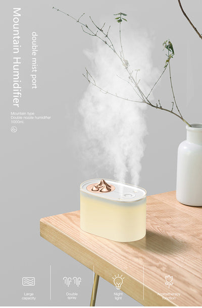 White portable humidifier with rose gold mountain-shaped mist outlet, 1000ml capacity, and compact design. - Image 11