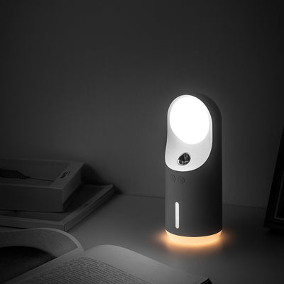 White and dark gray mini wireless ultrasonic humidifier and essential oil diffuser with an illuminated LED night lamp.