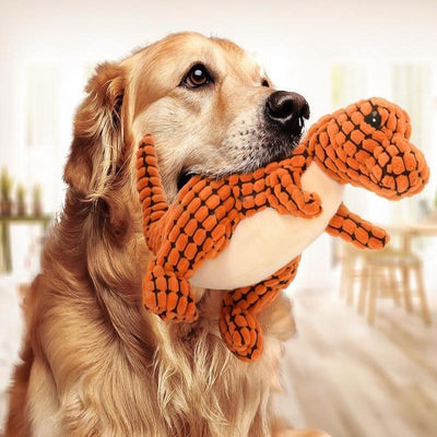 Brown textured corn velvet dinosaur plush toy with beige belly and black eyes, designed for dogs.