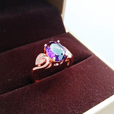 Rose gold necklace with a teardrop purple gemstone pendant and matching dangle earrings. - Image 19