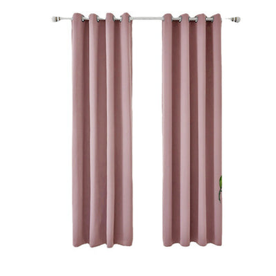 Light gray polyester blackout curtains with grommet tops hanging on a white rod in a modern living room. - Image 5