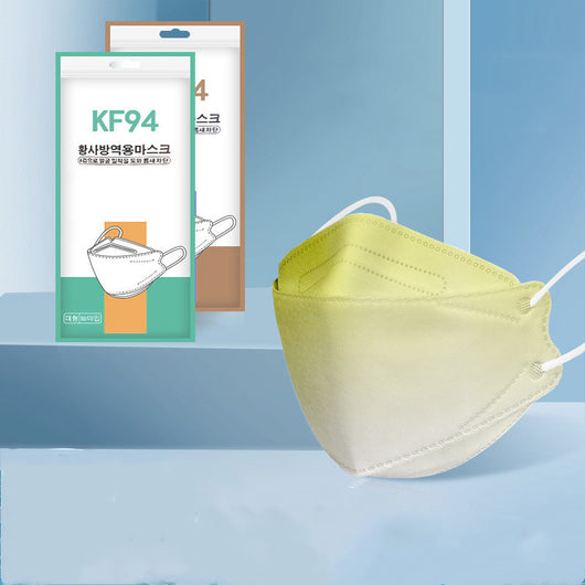 Pink gradient KF94 mask with white ear loops, displayed next to its packaging on a blue background. - Image 5