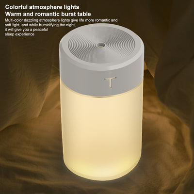 White and clear cylindrical mini humidifier with a 'T' logo, featuring a top mist outlet and transparent water tank. - Image 8