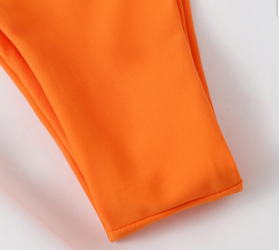 Orange split bikini set with a halter top and high-cut bottoms featuring wrap-around waist straps. - Image 13