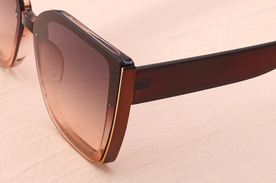 Women's black cat-eye sunglasses with large frames, gradient gray lenses, and gold-tone accents. - Image 21