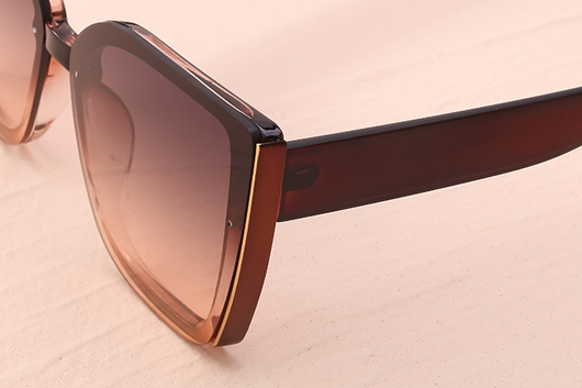 Women's black cat-eye sunglasses with large frames, gradient gray lenses, and gold-tone accents. - Image 21