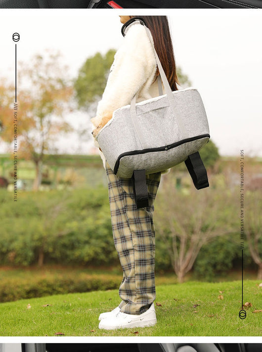 Grey pet car seat with plush white lining, designed for small dogs or cats, placed on a car's center console. - Image 14
