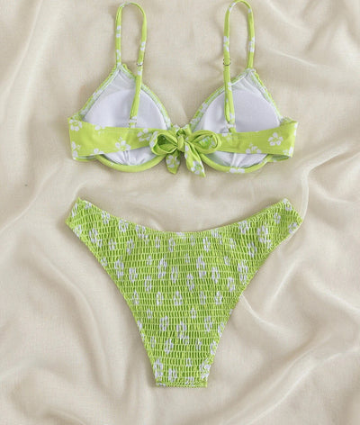 Periwinkle blue two-piece swimsuit with white floral pattern and ruched texture, featuring an underwire bikini top and high-cut bottoms. - Image 21