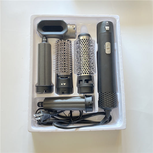 5-in-1 hot air comb hair dryer set with multiple rose red and gray attachments in a white tray. - Image 7