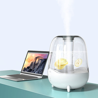 White and clear household silent air humidifier emitting mist, with lemon slices visible in the transparent water tank. - Image 9