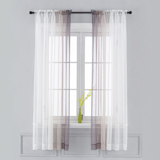 Pink and white gradient sheer rod pocket curtain panels hung on a black rod in front of a window. - Image 9