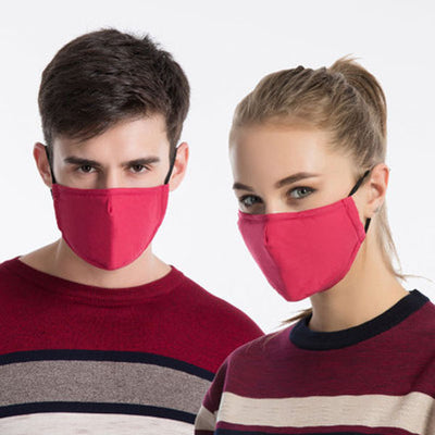 Young man wearing a black cotton face mask with adjustable ear loops, suitable for warmth and dust protection. - Image 2