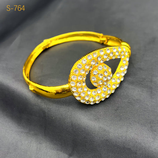 Gold-plated four-piece jewelry set with teardrop rhinestone necklace, bracelet, earrings, and ring on red velvet stands. - Image 11