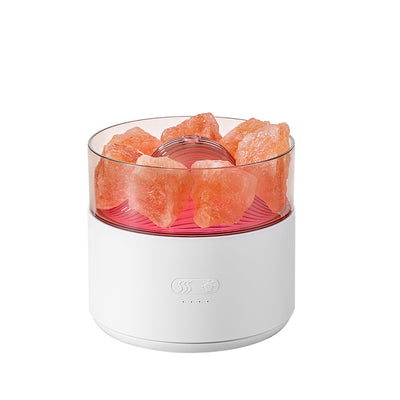 White cool-mist humidifier and aroma diffuser with glowing blue LED lights and orange crystal salt rocks, emitting mist. - Image 9