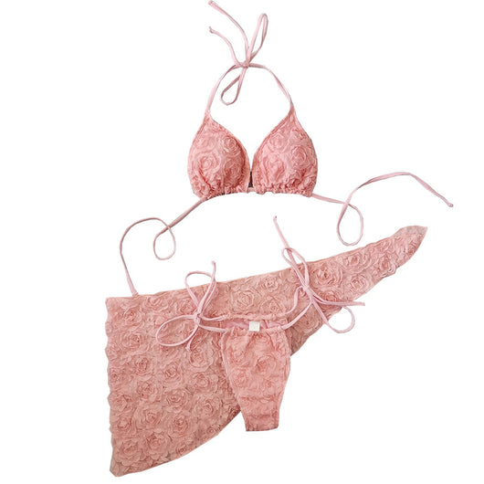 Red three-piece bikini set with a halter top, tie-side thong bottom, and sarong, all featuring a raised floral pattern. - Image 5