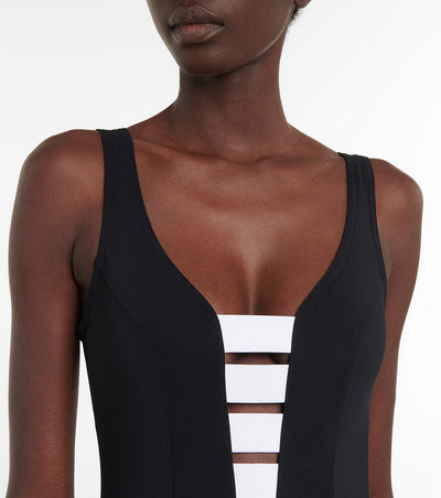 Black one-piece swimsuit with a deep V-neckline and white horizontal stitching detail across the plunge. - Image 15