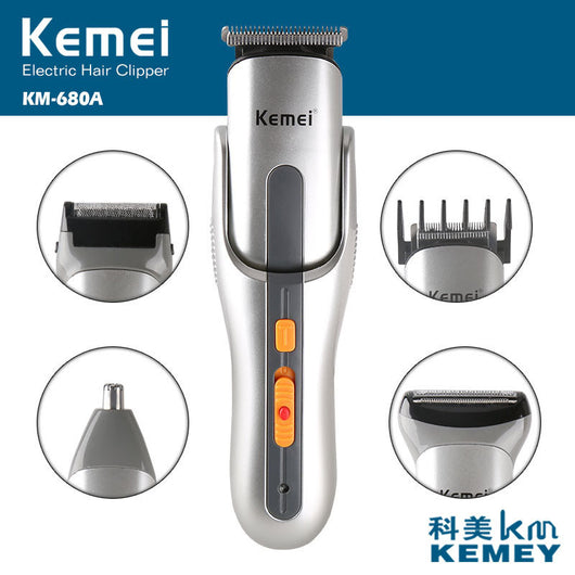 Kemei multi-function hair clipper set with silver and black body, orange buttons, and multiple interchangeable heads on a black charging base. - Image 2