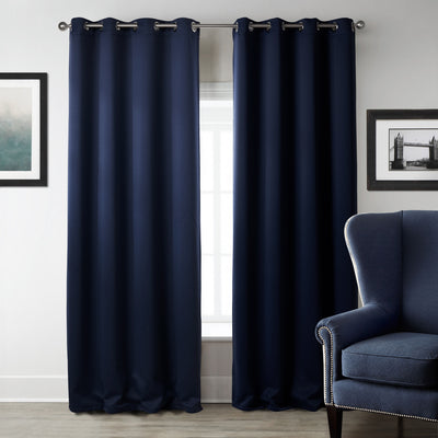 Dark blue blackout curtains with silver grommet tops hanging on a rod in a modern bedroom setting. - Image 7
