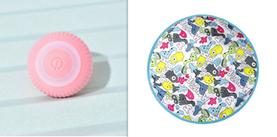 Pink round electronic cat toy with power symbol and a circular cat play mat with cartoon animals and pink border. - Image 10