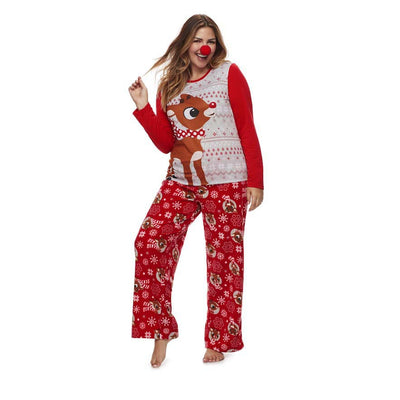 Family of five wearing matching red and white Christmas pajamas with reindeer and snowflake patterns. - Image 3