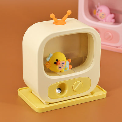 Pink TV-shaped desktop humidifier with a cute pink caterpillar figure inside, featuring a mist outlet and control knob. - Image 9